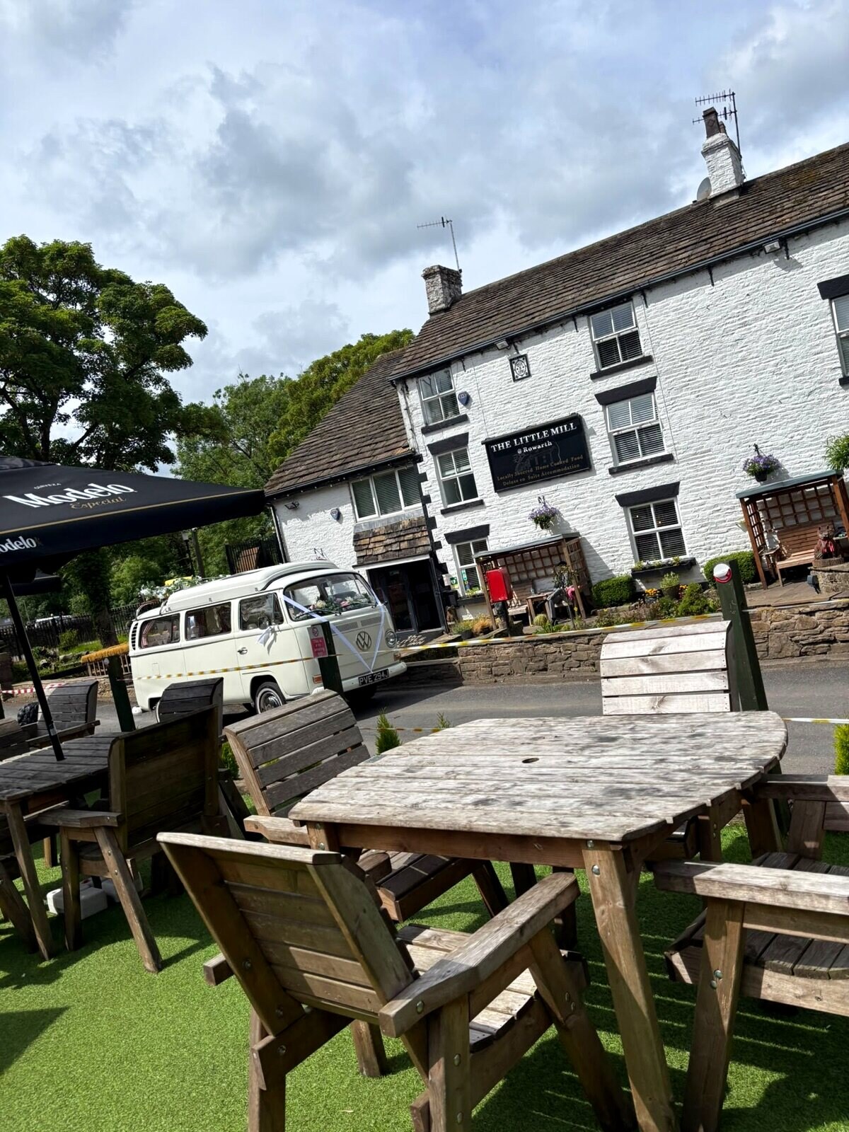 The pub frontage and garden seating on a wedding morning