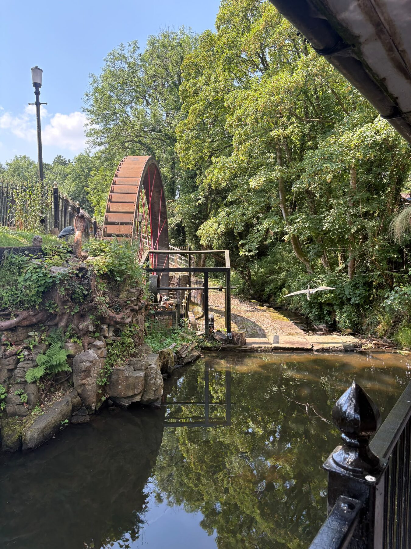 The 35-foot waterwheel beside the mill pond on Rowarth Brook at The Little Mill Inn
