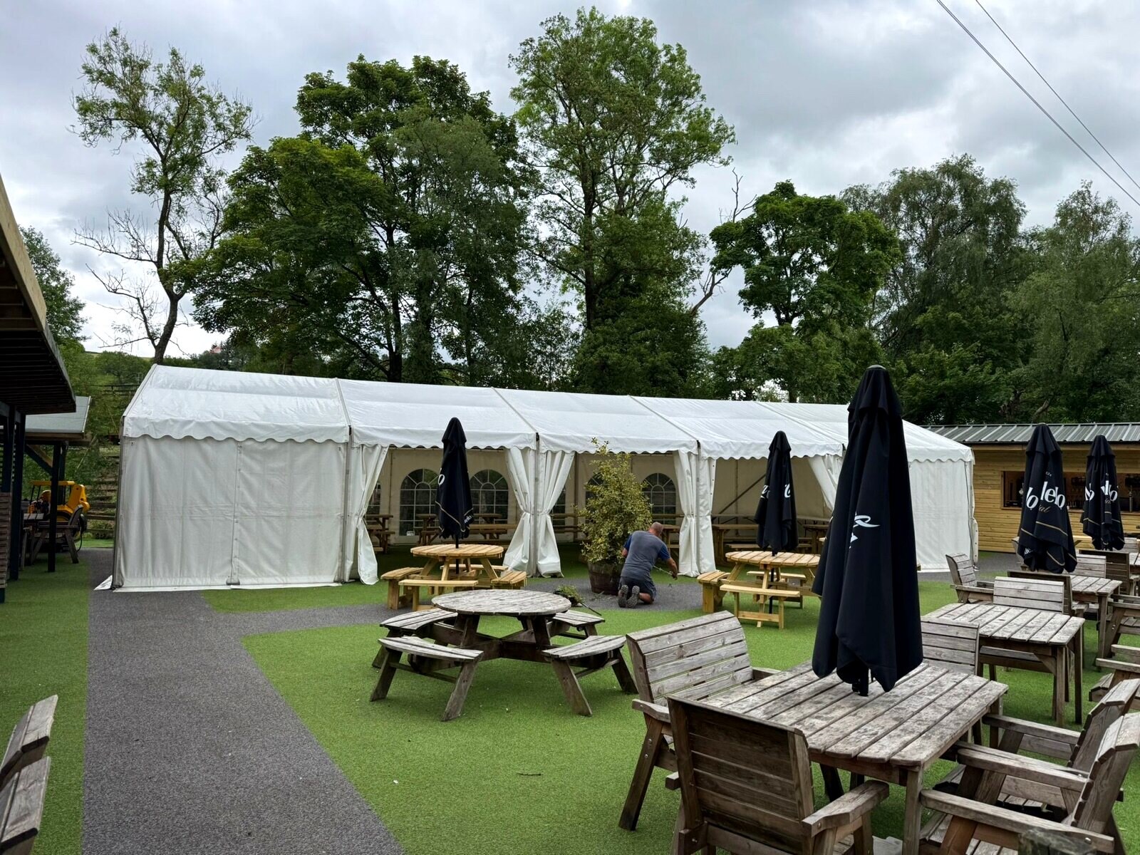 The outside bar, marquee and garden seating at The Little Mill Inn